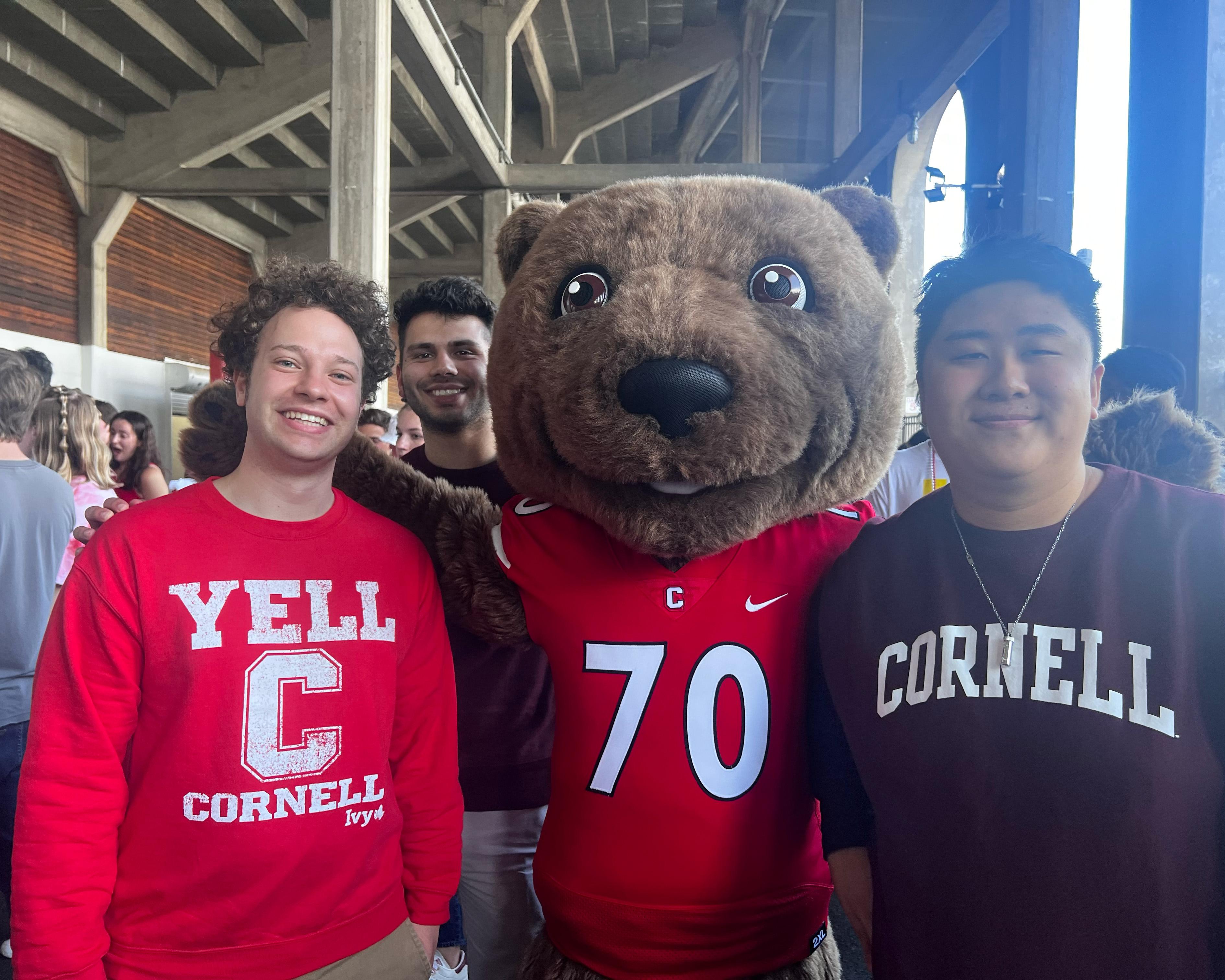 Me, my housemates, and Touchdown the cornell mascot at a football game